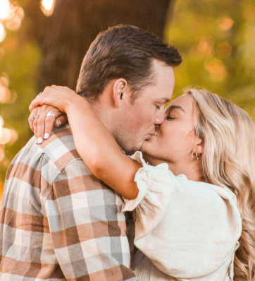 A couple in love, wrapped in each other's arms, lost in the moment.